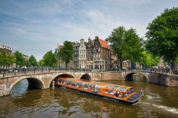 orange canal boats Amsterdam