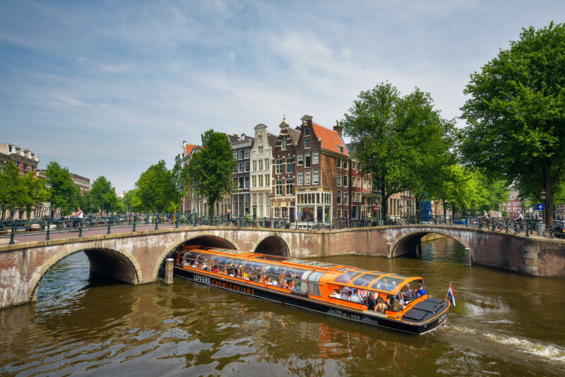 orange canal boats Amsterdam