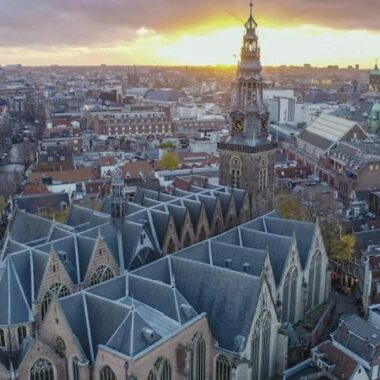 Aerial view of the Oude Kerk and its tower in the heart of Amsterdam
