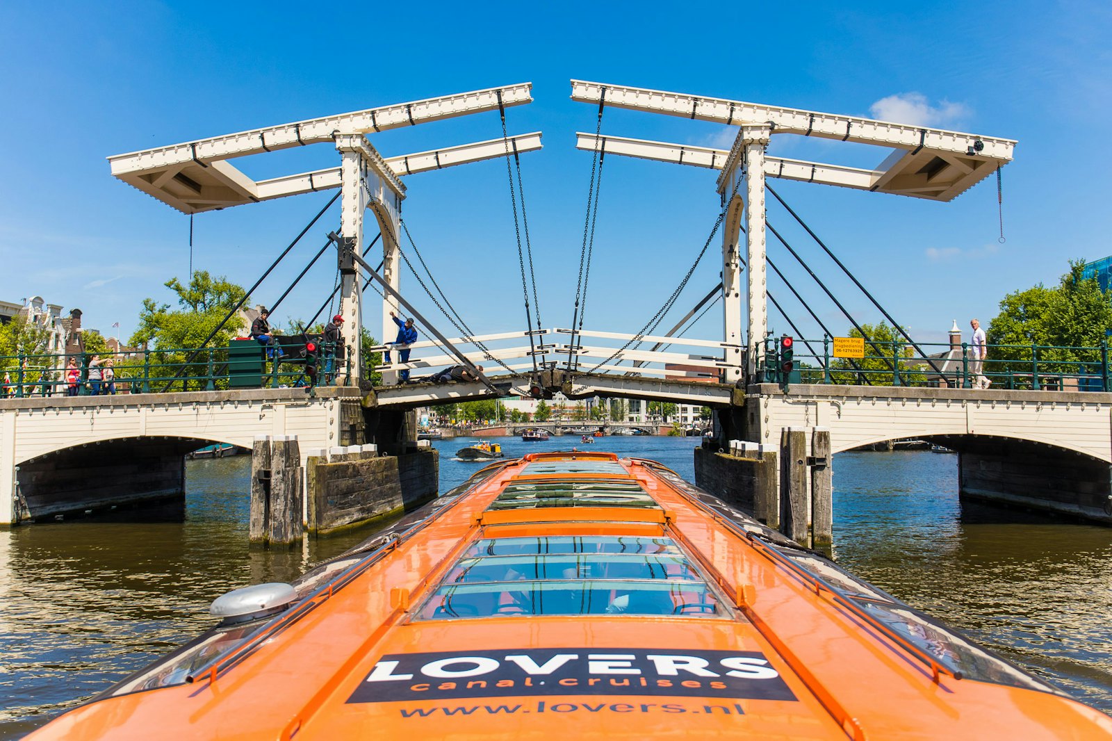 View from the roof of a canal cruise boat passing under the Magere Brug on the Amstel